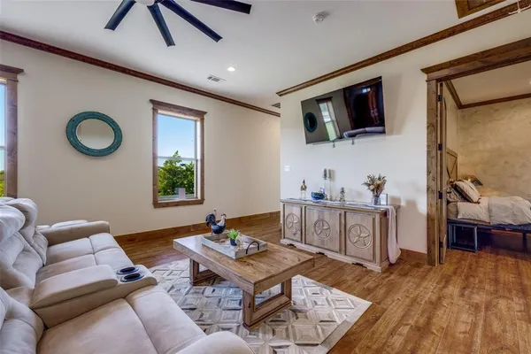 a living room with furniture and a flat screen tv