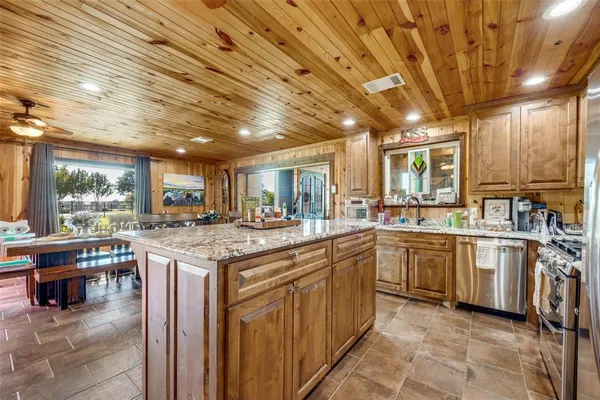 a kitchen with lots of counter top space and appliances