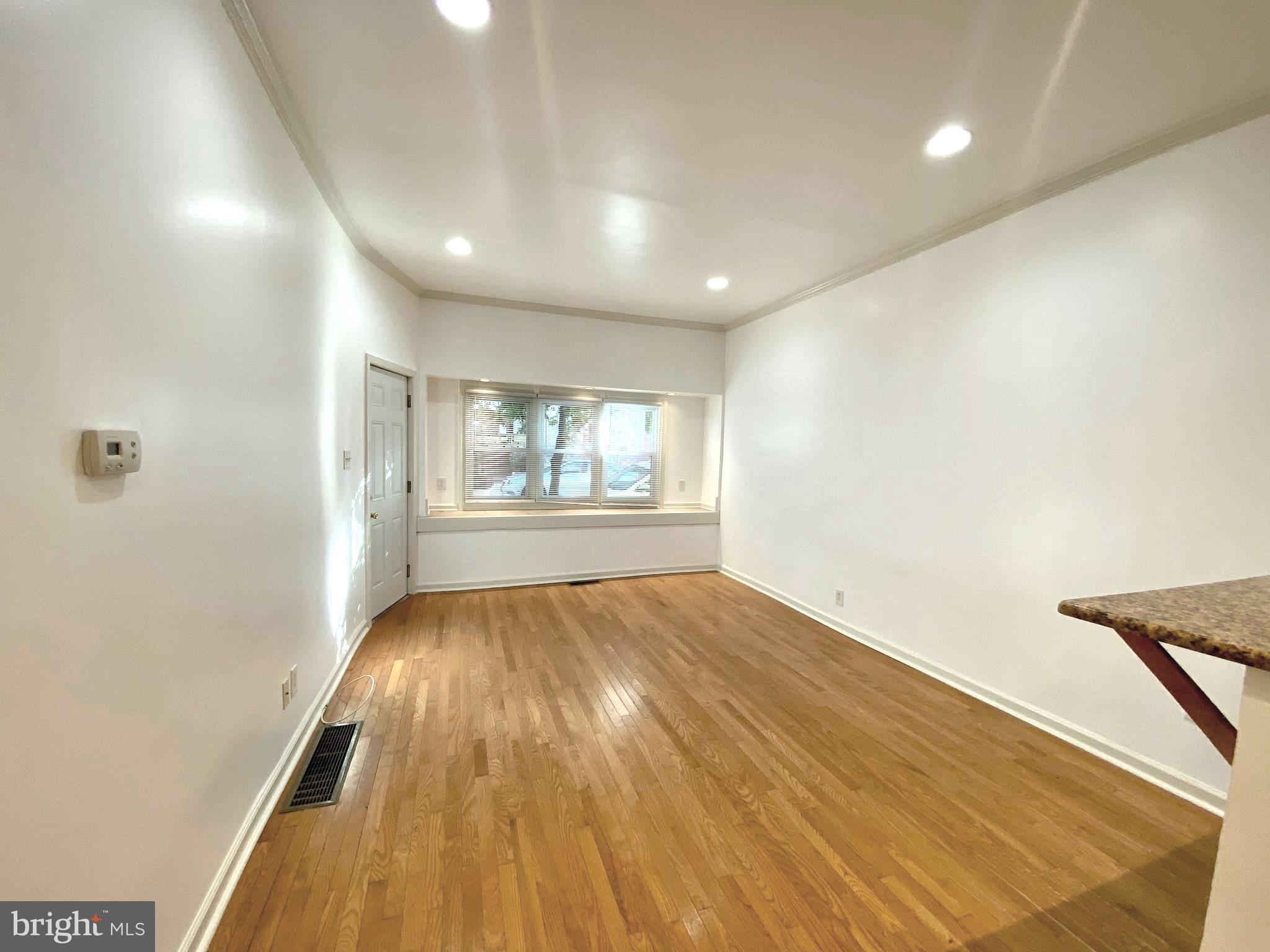3856 Terrace Street Philadelphia, PA 19128 - Photo 16 of 27 an empty room with wooden floor and windows