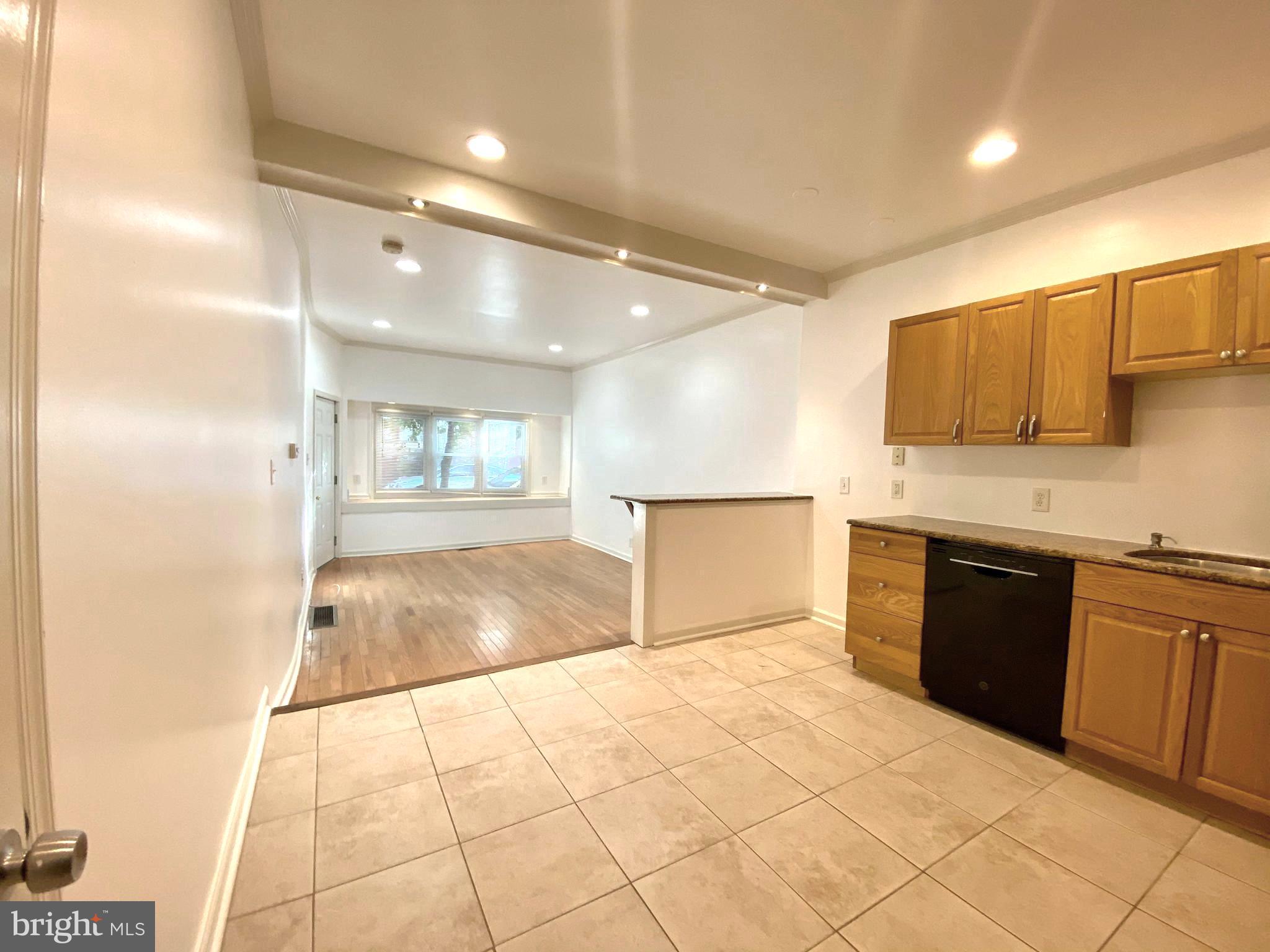3856 Terrace Street Philadelphia, PA 19128 - Photo 18 of 27 a view of a kitchen with kitchen island granite countertop a refrigerator and a sink