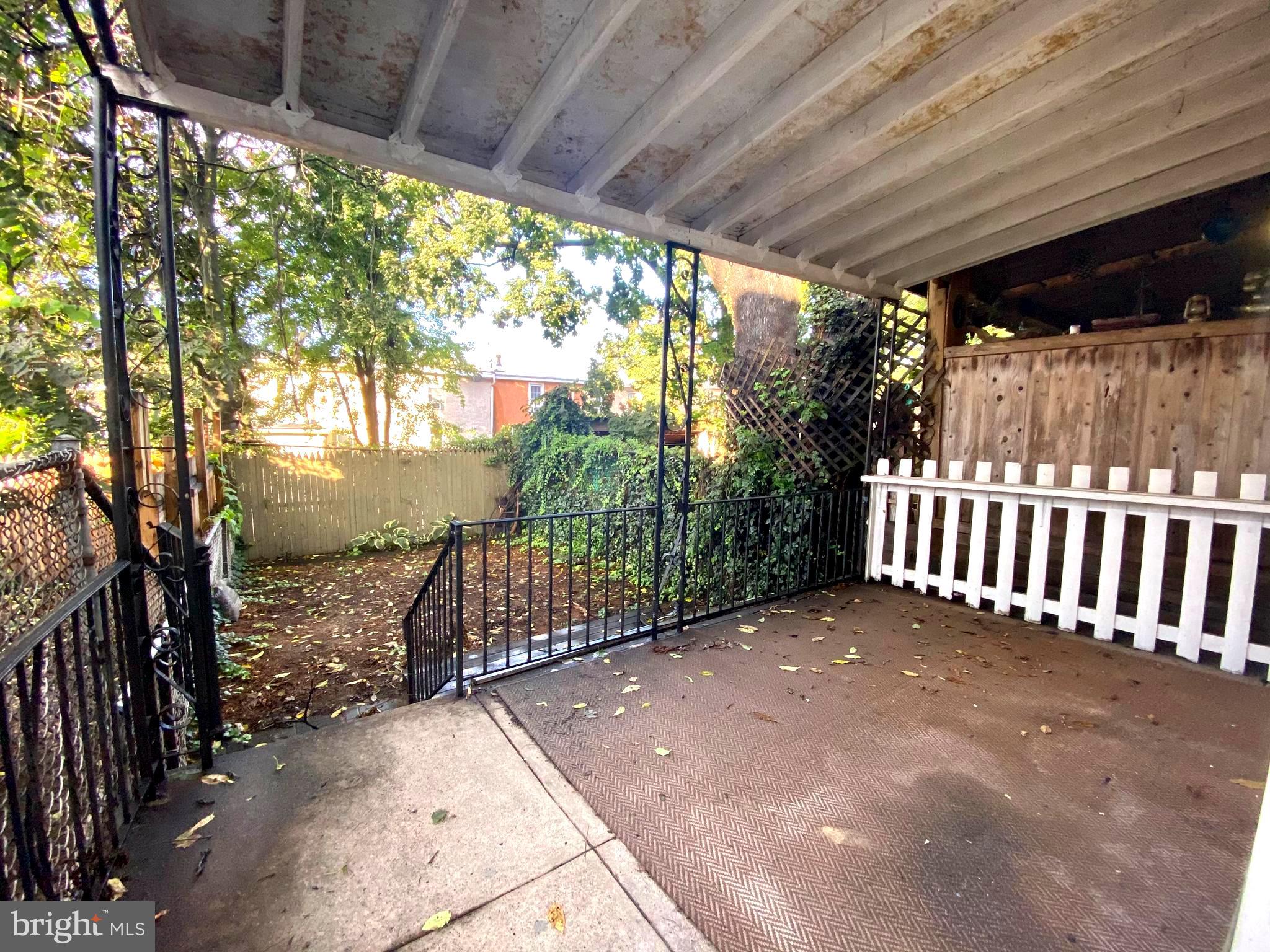 3856 Terrace Street Philadelphia, PA 19128 - Photo 24 of 27 a view of a backyard with a large tree