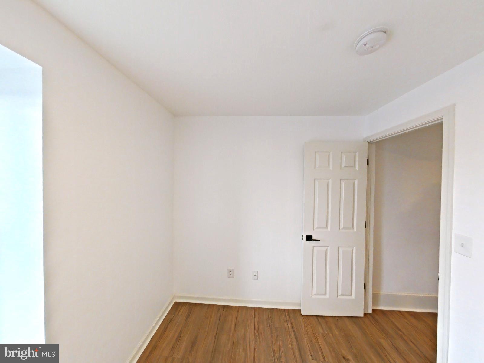 3856 Terrace Street Philadelphia, PA 19128 - Photo 6 of 27 a view of a room with wooden floor and white walls