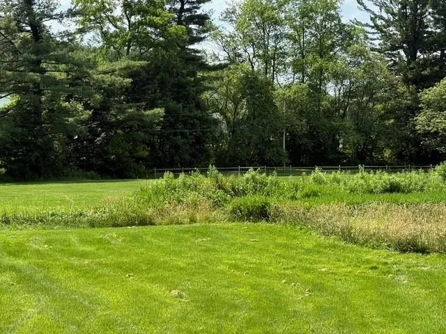 a view of outdoor space with deck and yard
