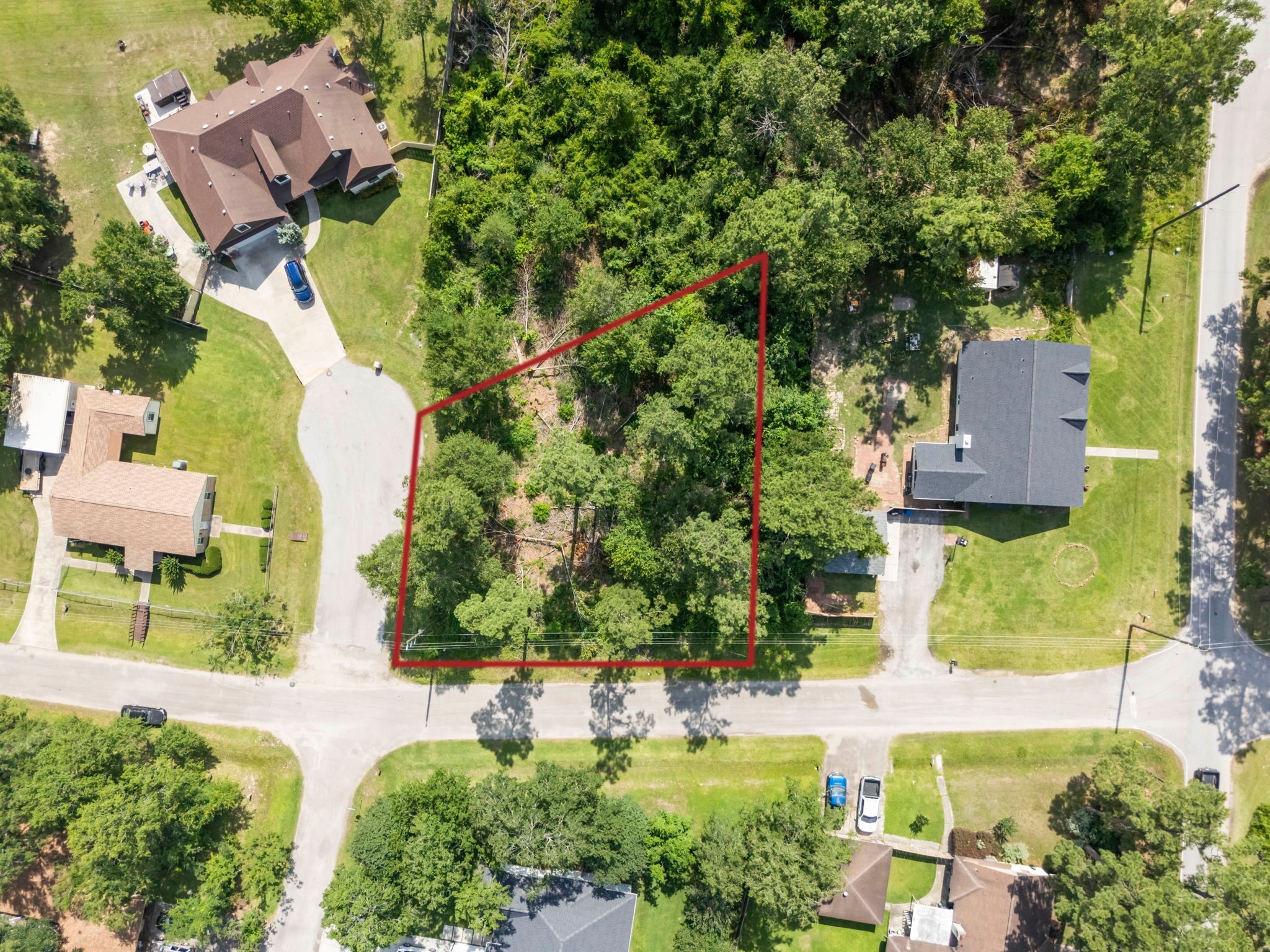 an aerial view of a house with a yard swimming pool and outdoor seating