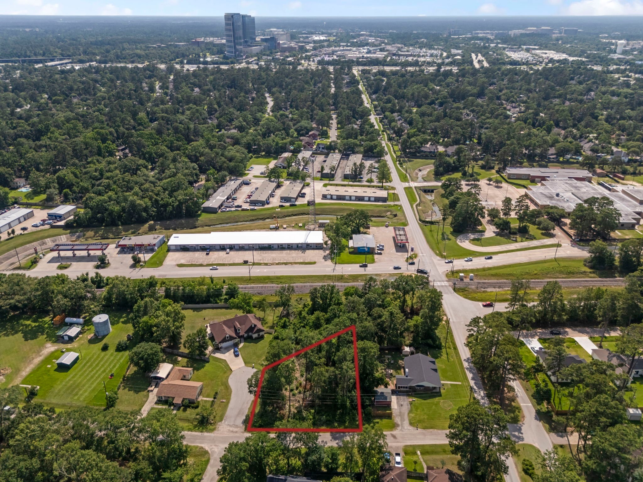 0 Tallow Drive Conroe, TX 77385 - Photo 4 of 11 an aerial view of residential houses with outdoor space and trees