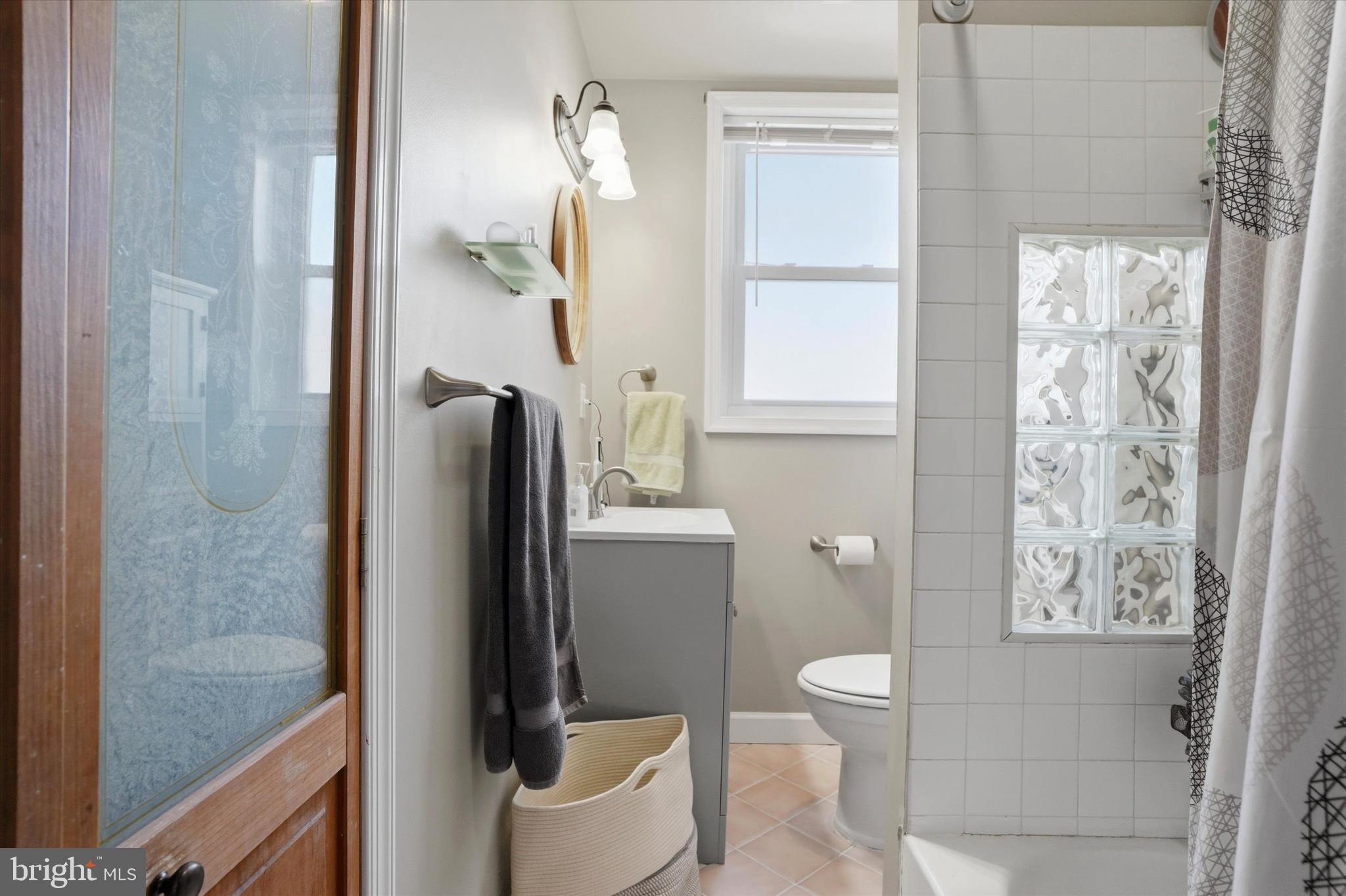 425 Righter Street Philadelphia, PA 19128 - Photo 17 of 35 a bathroom with a granite countertop bathtub shower and toilet