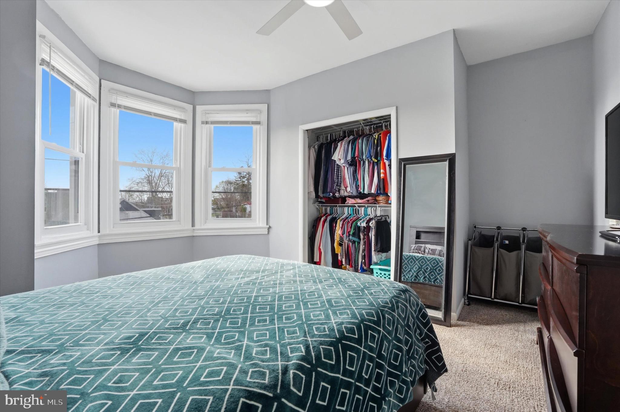 425 Righter Street Philadelphia, PA 19128 - Photo 20 of 35 a bedroom with a bed and a large window
