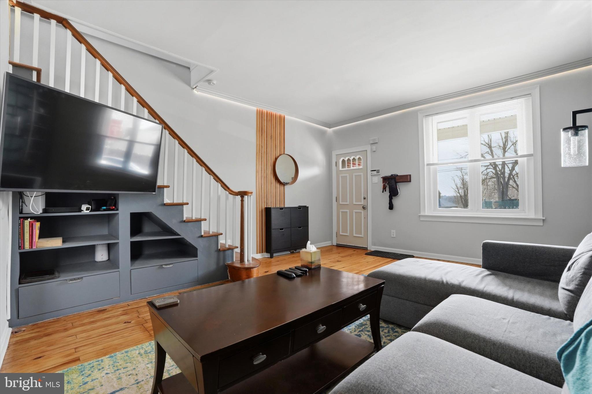 425 Righter Street Philadelphia, PA 19128 - Photo 6 of 35 a living room with furniture and a flat screen tv