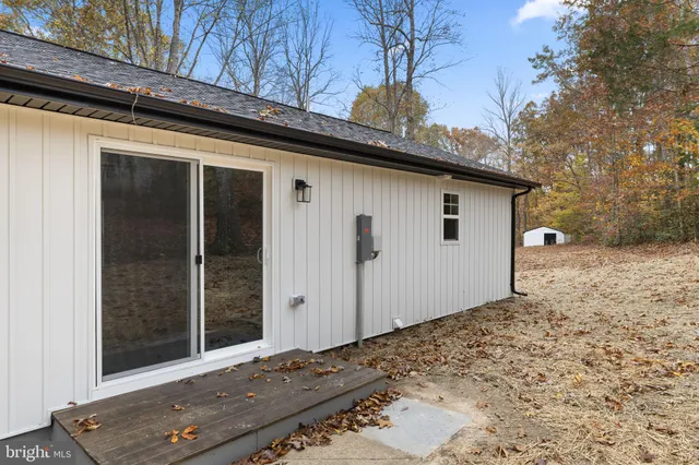 a house view with a backyard space