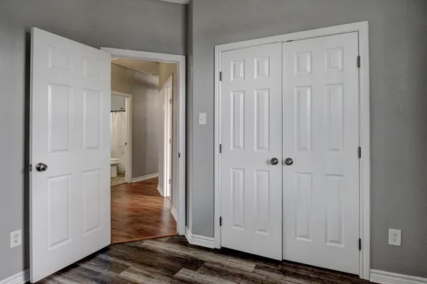 a view of a livingroom with wooden floor