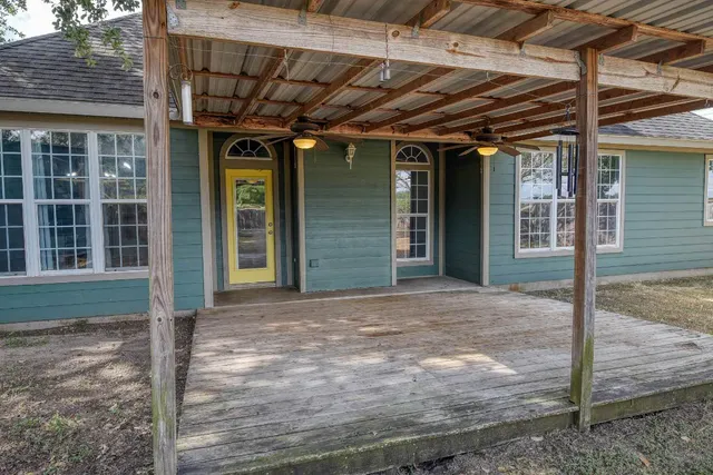 a view of a house with porch and wooden floor