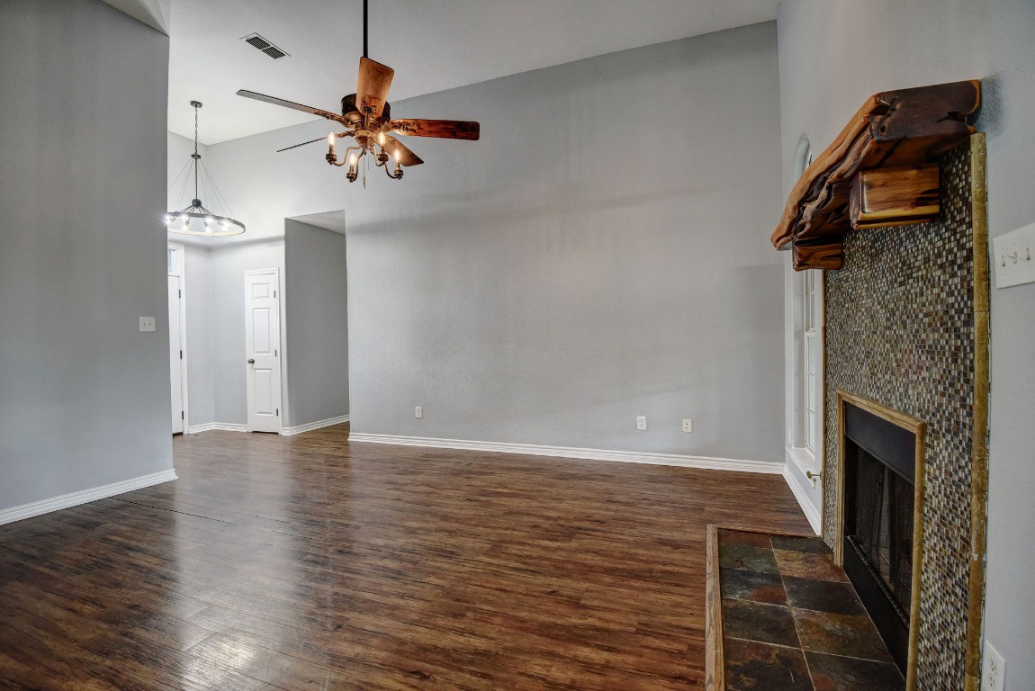 340 Rose Mayer Loop La Grange, TX 78945 - Photo 5 of 30 an empty room with wooden floor fan and windows