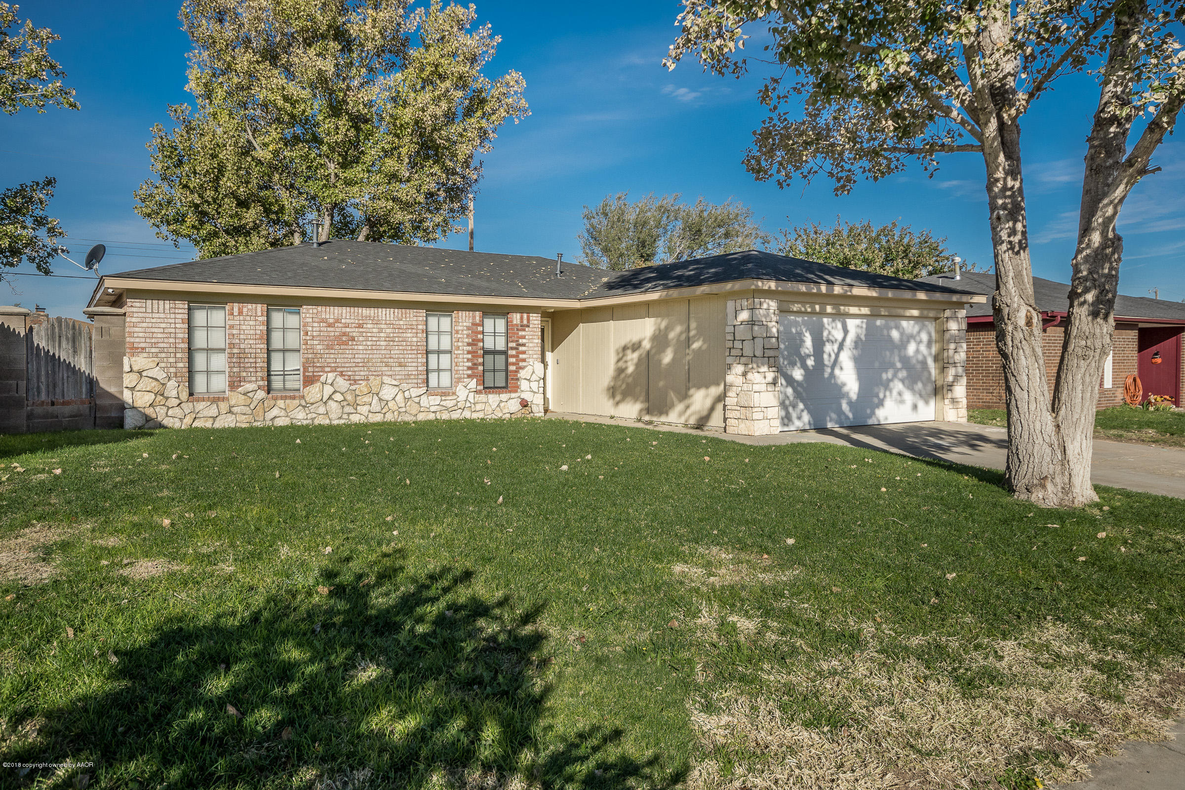 5332 Whitney Lane Amarillo, TX 79110 - Photo 1 of 17 a view of a yard with plants and large trees