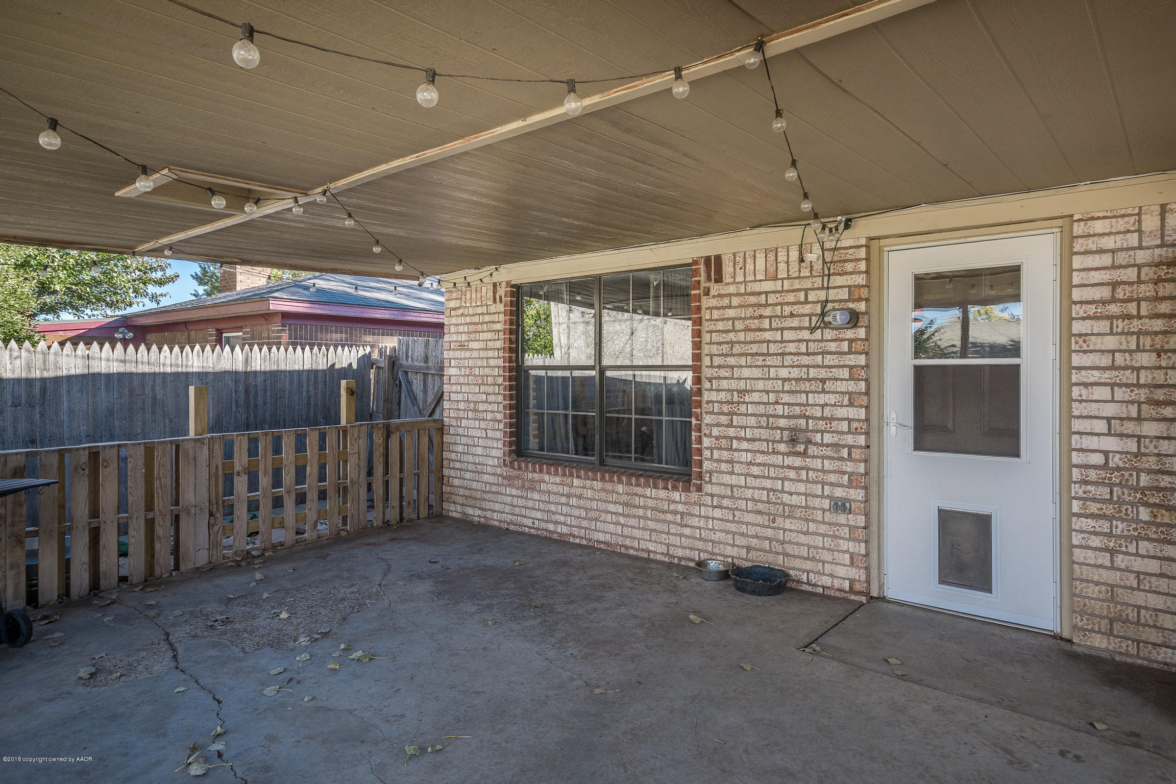 5332 Whitney Lane Amarillo, TX 79110 - Photo 16 of 17 a view of a porch with a door