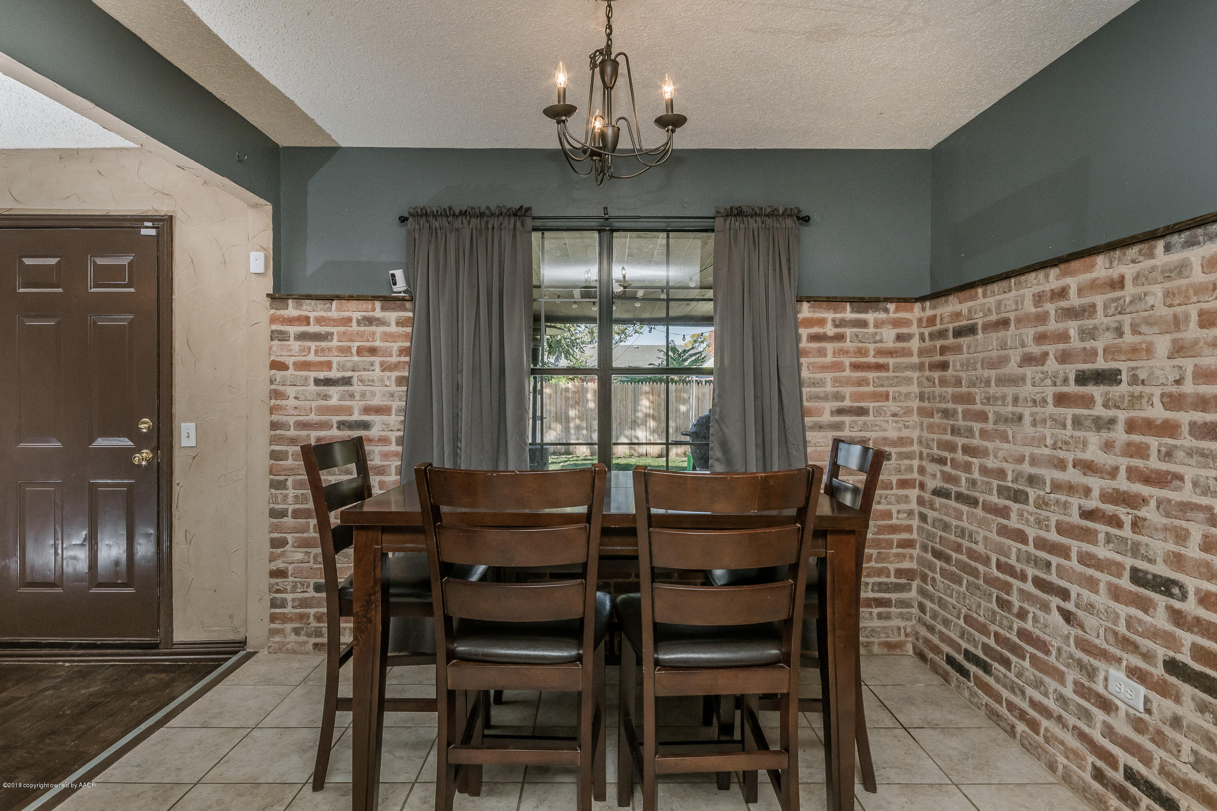 5332 Whitney Lane Amarillo, TX 79110 - Photo 5 of 17 a view of a dining room with furniture and chandelier