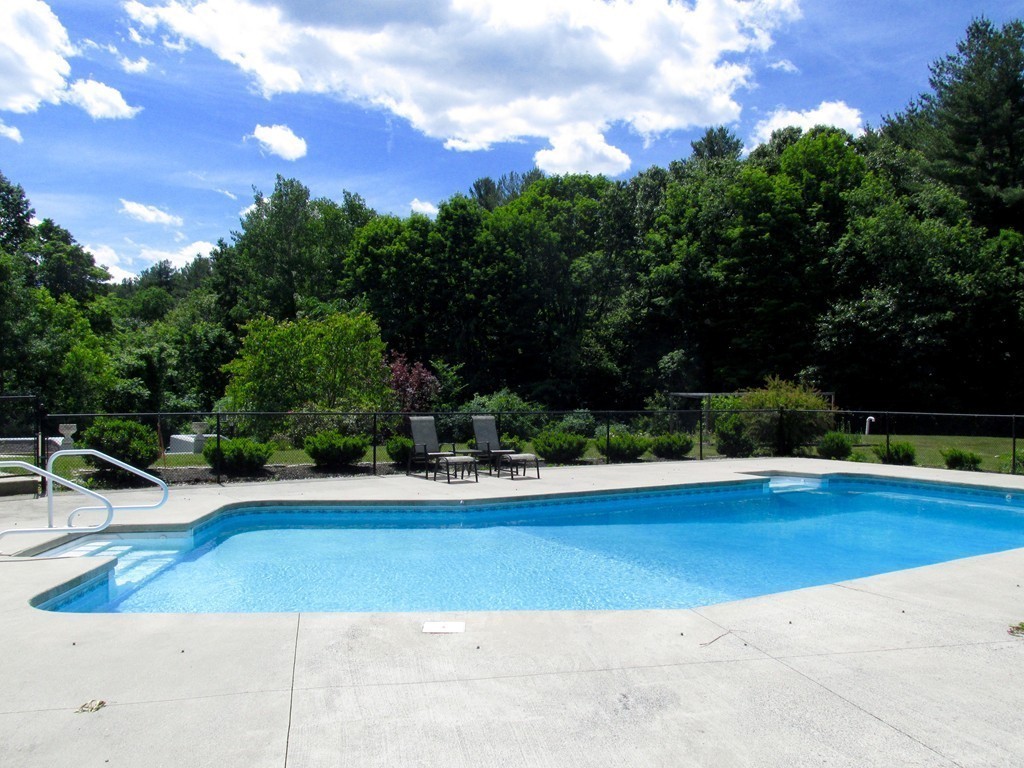 28 Allen Road Berlin, MA 01503 - Photo 4 of 30 a view of a swimming pool with an outdoor seating and a lots of trees