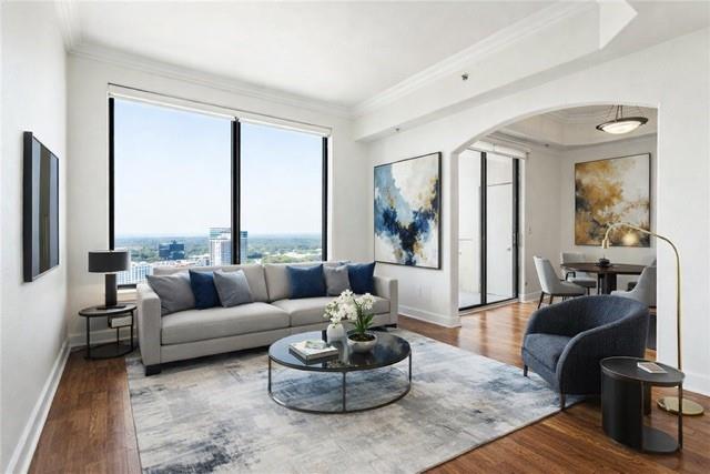 3445 Stratford Road Northeast, Unit 3102 Atlanta, GA 30326 - Photo 1 of 1 a living room with furniture and a large window