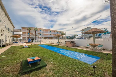 a view of a swimming pool with outdoor seating