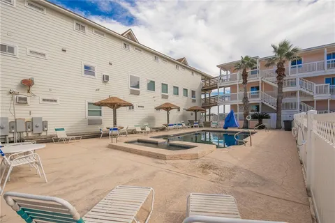 a view of a swimming pool with an outdoor seating