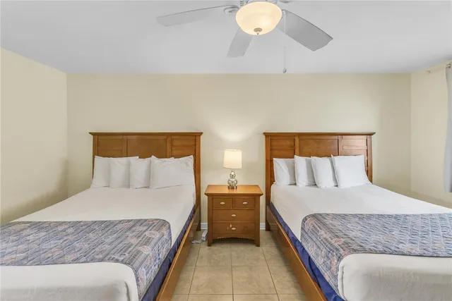 a bedroom with a bed and lamps