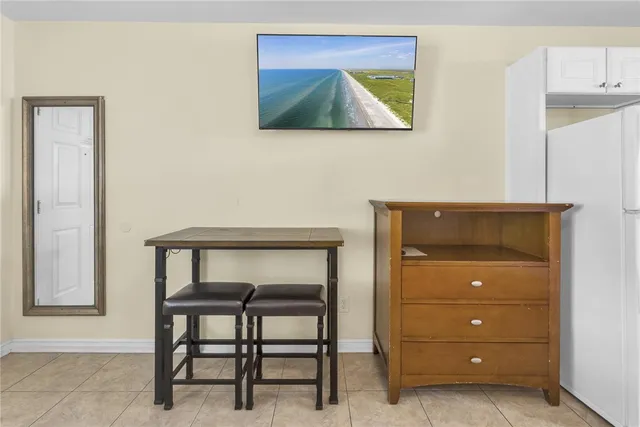 a room with a lamp and a table