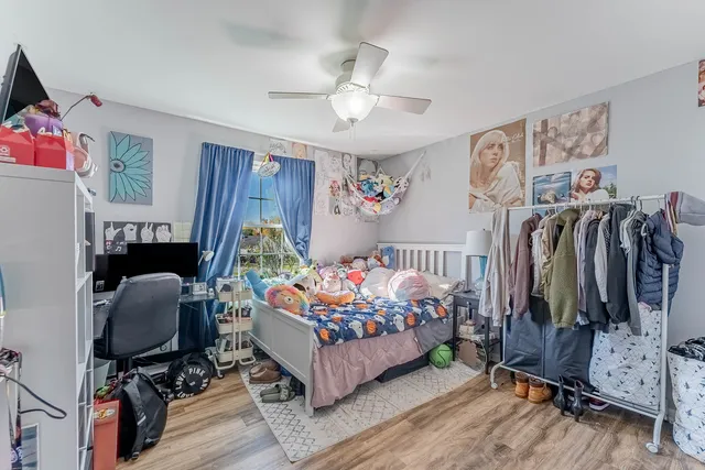 a bedroom with bed and a window