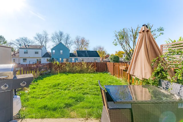 a view of yard and swimming pool
