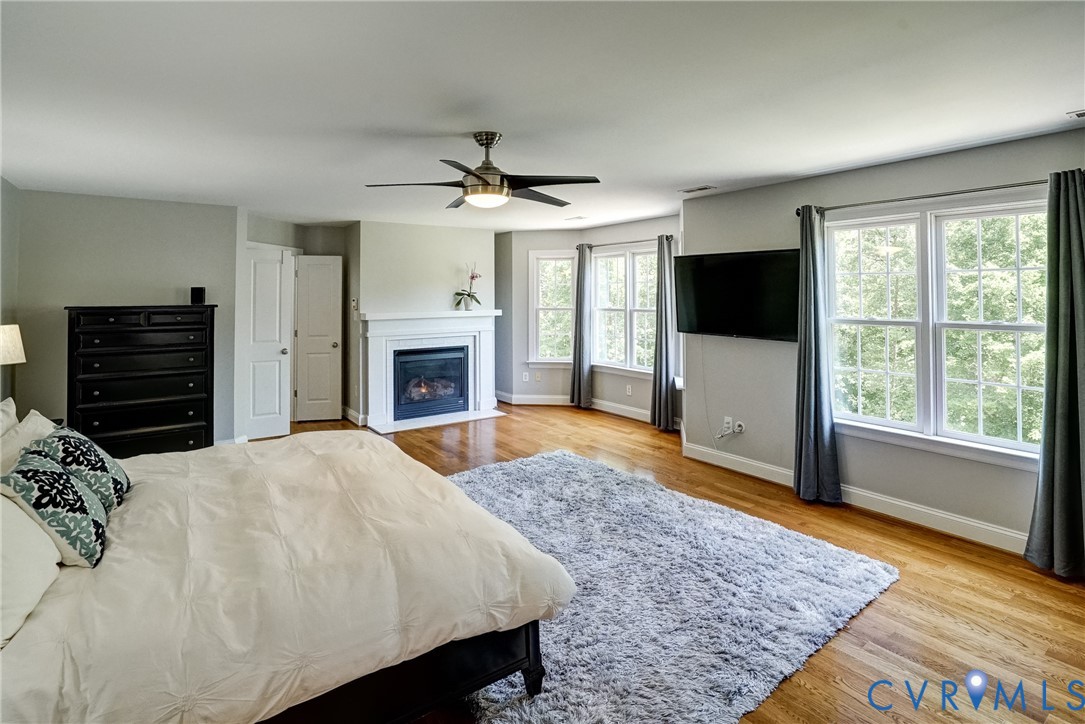 1295 Hermitage Road Manakin-Sabot, VA 23103 - Photo 42 of 55 a spacious bedroom with a bed and a flat screen television