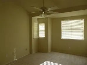 a view of an empty room with a window