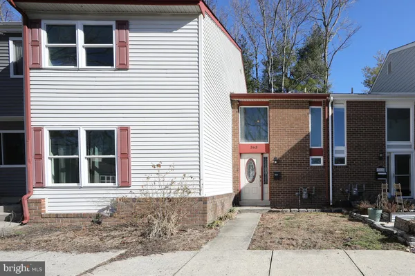 a house with trees in front of it