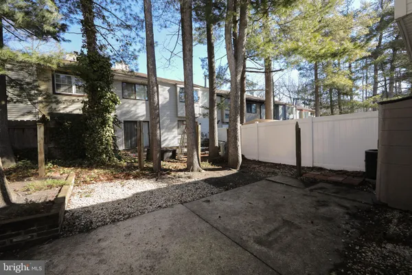 a view of a house with backyard