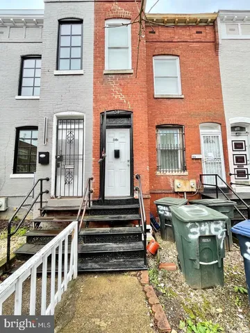 a group of people sitting in front of a building