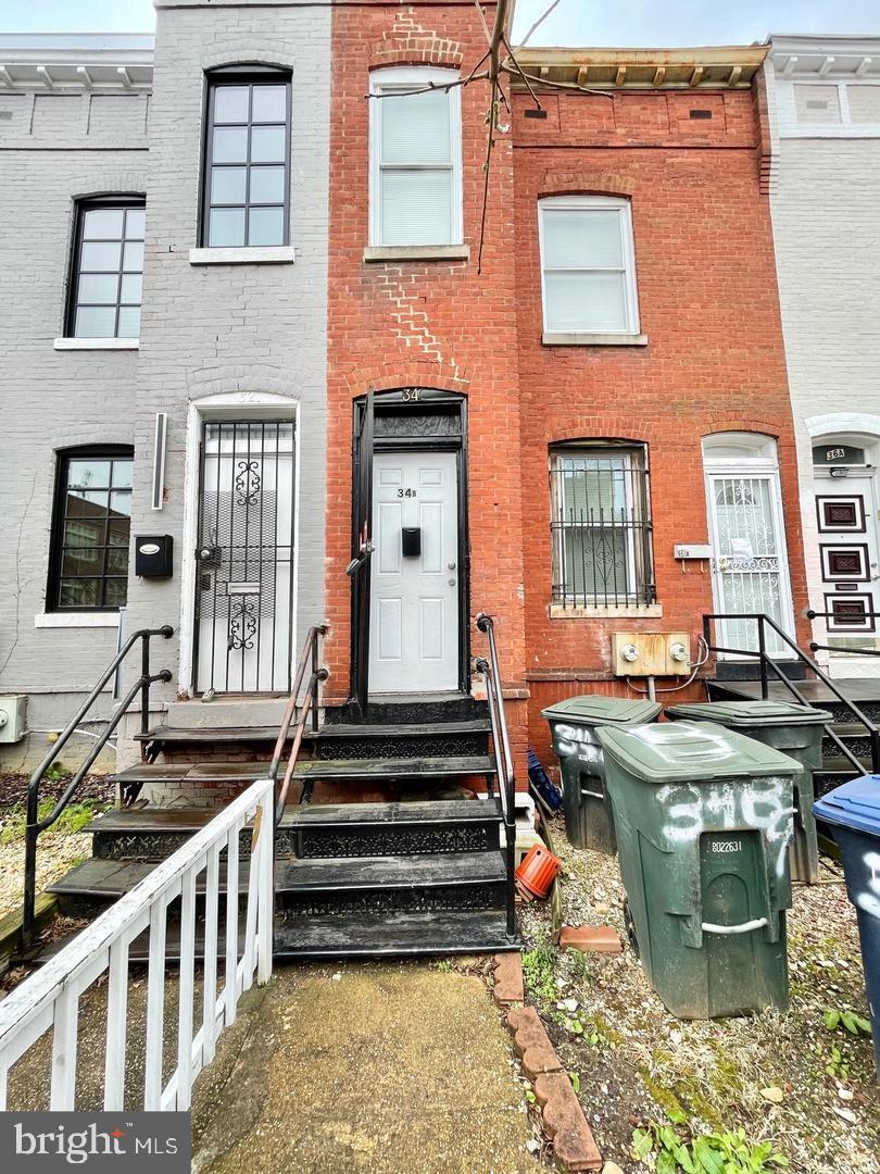 a group of people sitting in front of a building