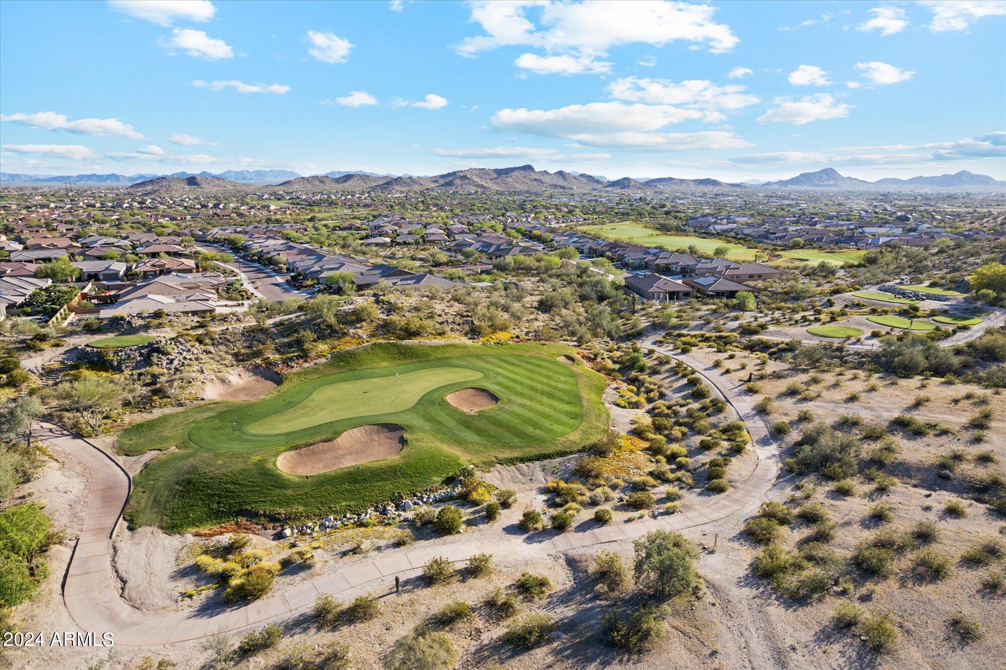 18095 West Narramore Road Goodyear, AZ 85338 - Photo 46 of 48 17th hole with mountain views