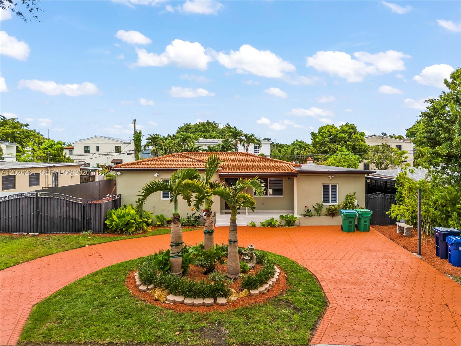 6250 Southwest 20th Terrace Miami, FL 33155 - Photo 4 of 42 a house view with a garden space