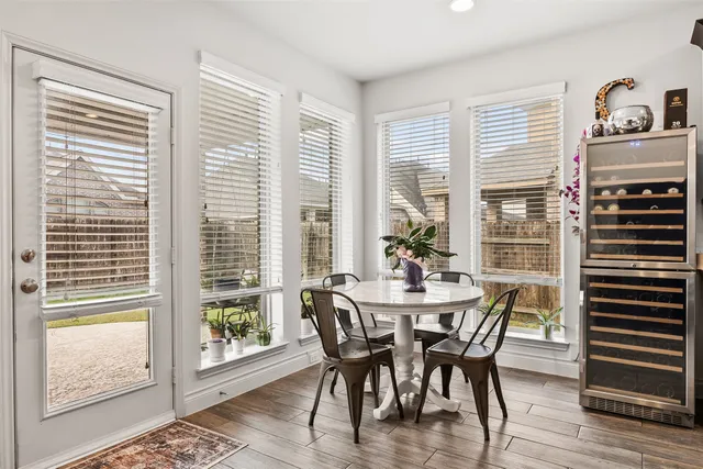 a view of a dining room with furniture and windows