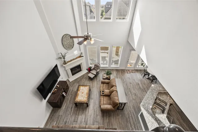 a view of living room with furniture and a fireplace