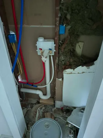 a bathroom with a sink toilet and mirror