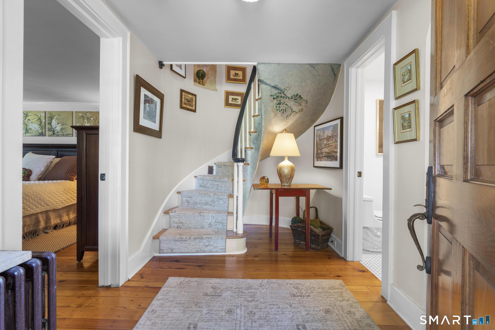 394 Wakeman Road Fairfield, CT 06824 - Photo 3 of 40 This curved staircase is just one of the many charming details of this 1931 custom-built home.