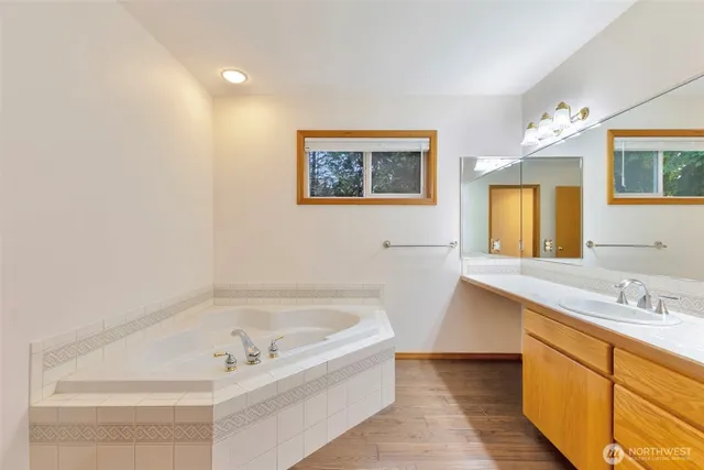 a bathroom with a bathtub and a sink