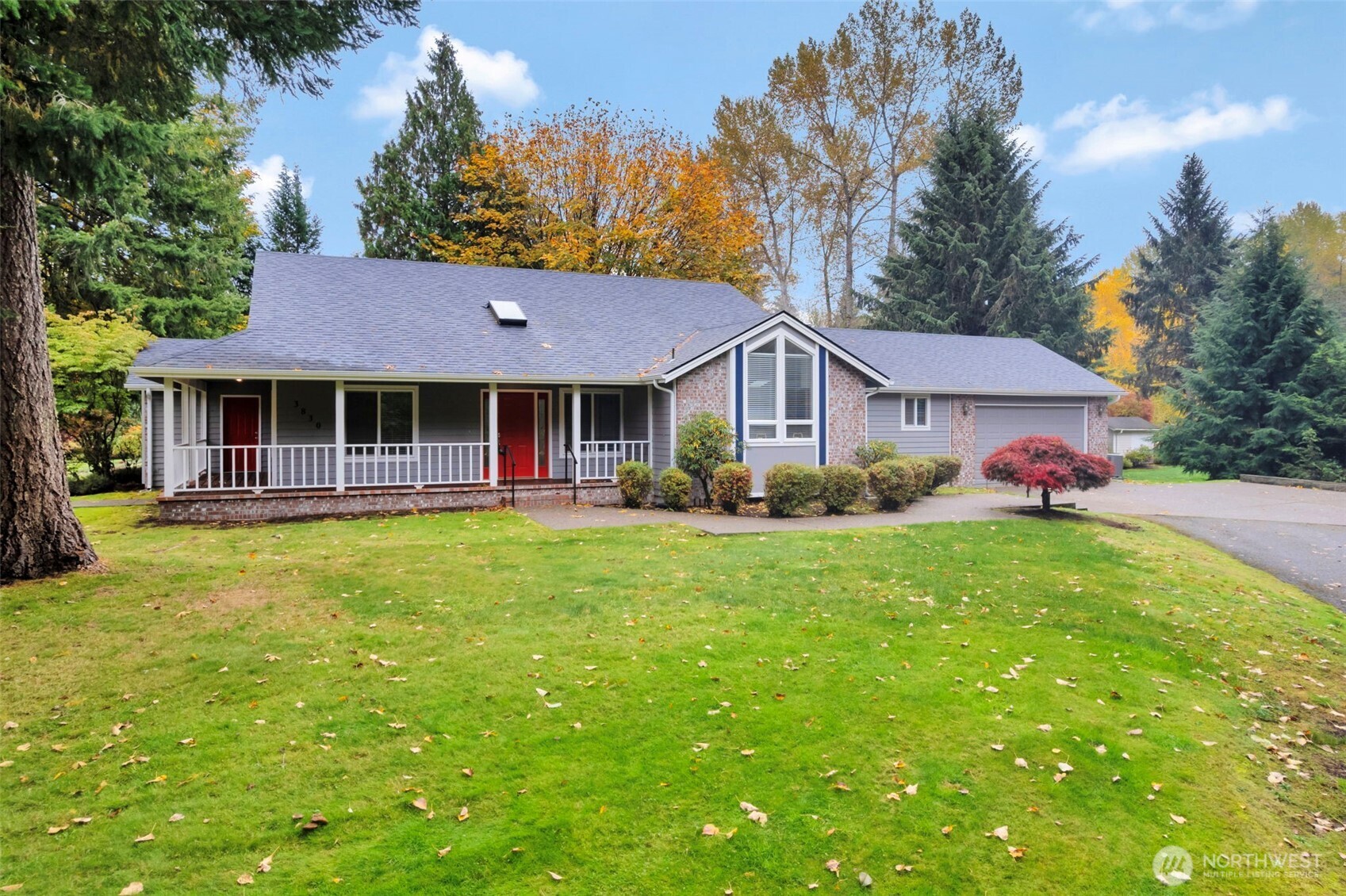 3830 Mari Lane Southeast Olympia, WA 98513 - Photo 2 of 32 a front view of a house with yard and green space