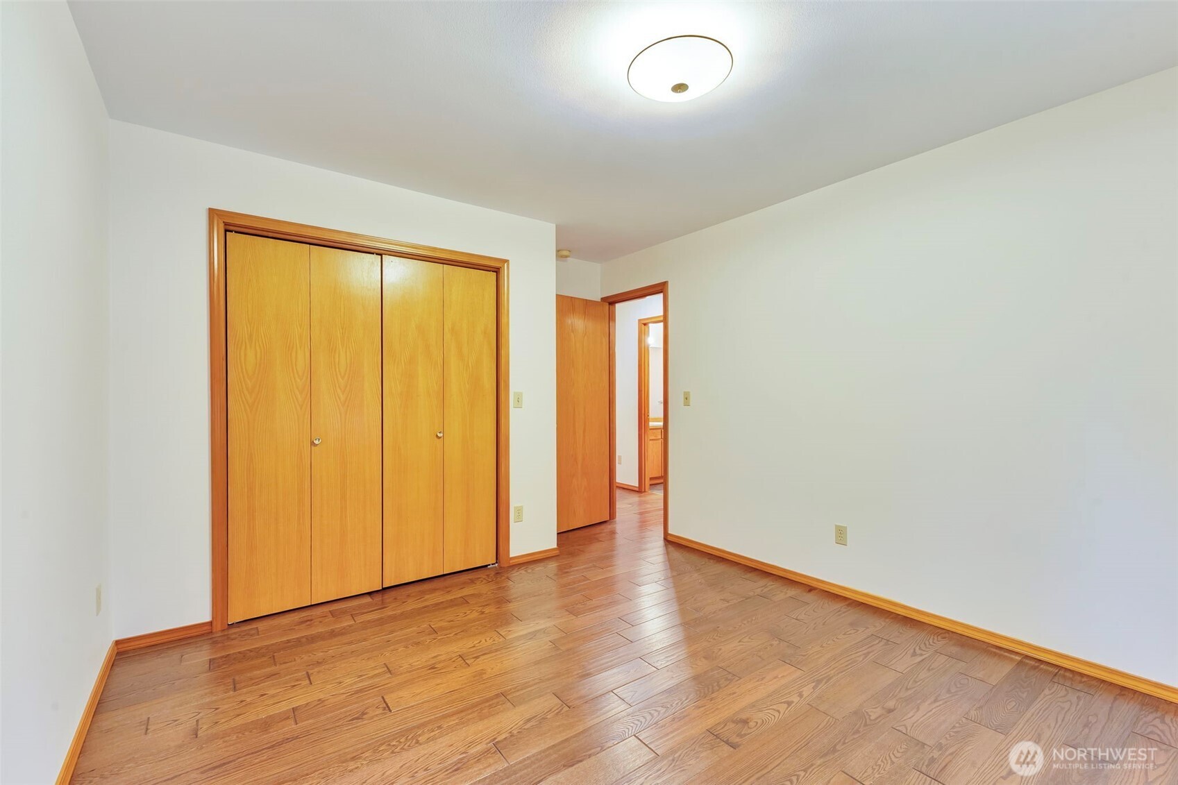 3830 Mari Lane Southeast Olympia, WA 98513 - Photo 26 of 32 an empty room with wooden floor and closet