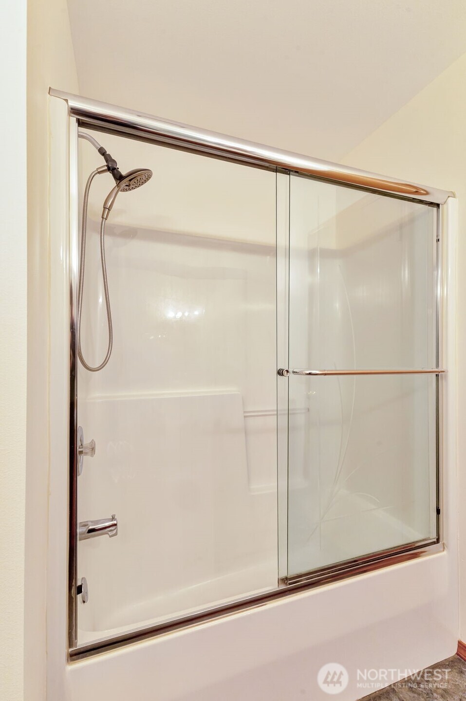 3830 Mari Lane Southeast Olympia, WA 98513 - Photo 28 of 32 a bathroom with a glass shower door