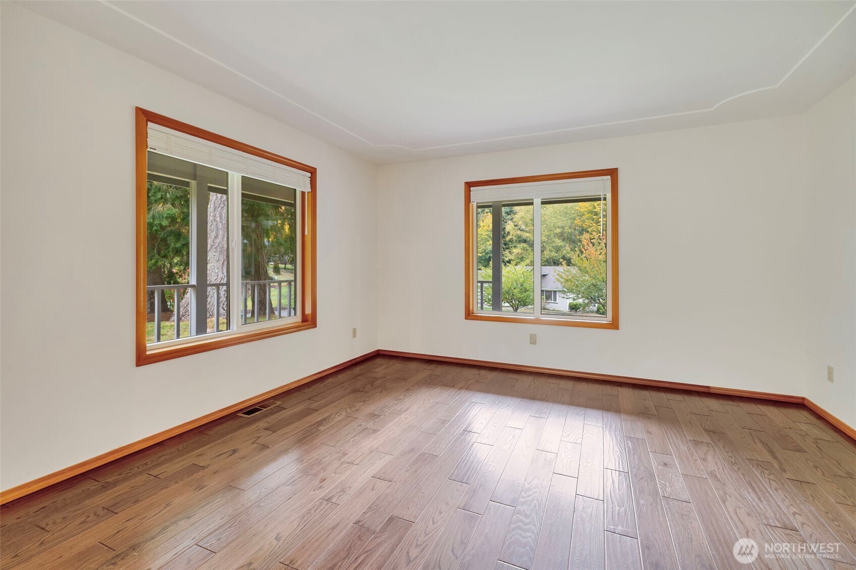 3830 Mari Lane Southeast Olympia, WA 98513 - Photo 5 of 32 a view of an empty room with wooden floor and a window