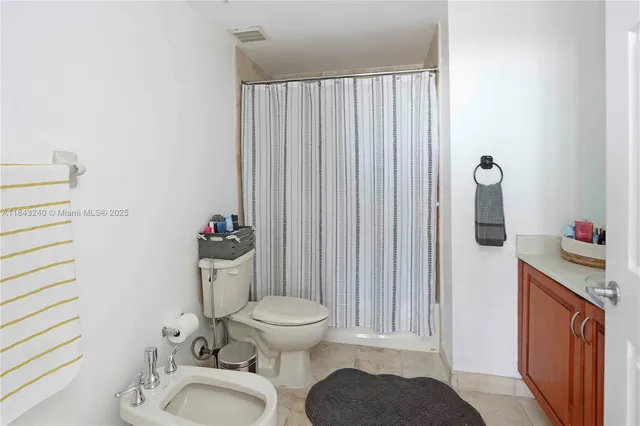 a bedroom with a bed and a table in it