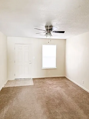 a view of a big room with carpet