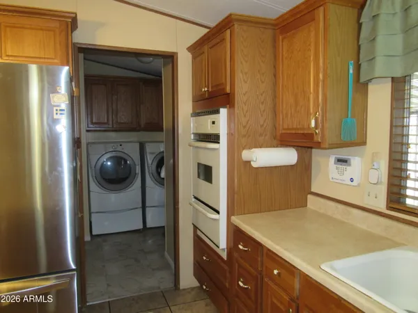 a kitchen with a refrigerator and cabinets
