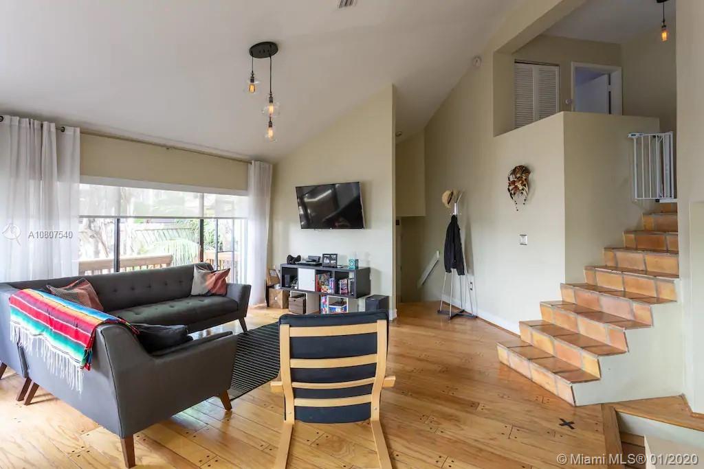 2575 Tigertail Avenue, Unit 2575 Miami, FL 33133 - Photo 1 of 13 Living room with vaulted ceilings