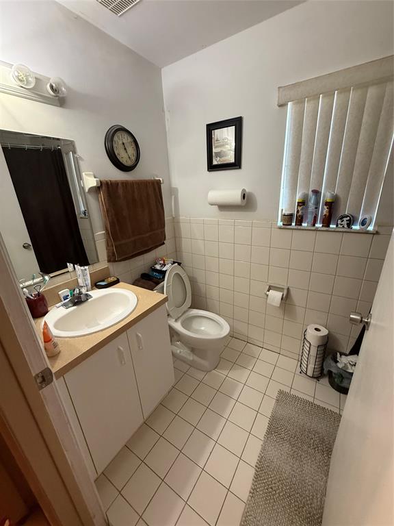 10262 Southwest 179th Street Miami, FL 33157 - Photo 17 of 26 a bathroom with a sink toilet and mirror
