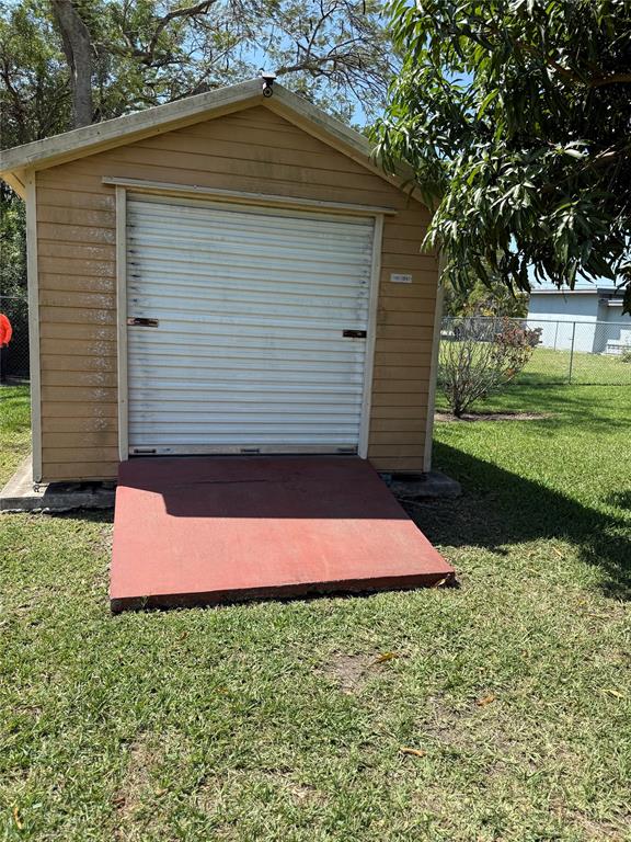 10262 Southwest 179th Street Miami, FL 33157 - Photo 22 of 26 a small yard with a small barn in the back yard